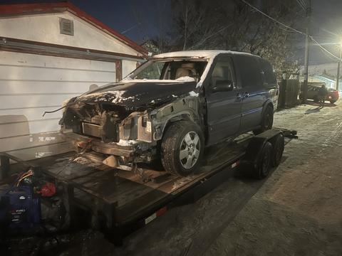 Damaged Minivan Ready for Scrap Metal Recycling