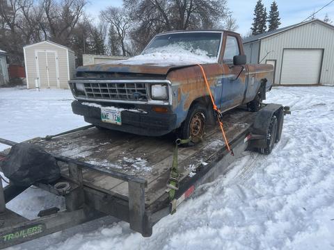 Old Truck on Trailer for Scrap Metal Recycling in Winter Setting