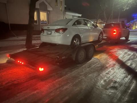 Nighttime Scrap Car Towing for Recycling Business
